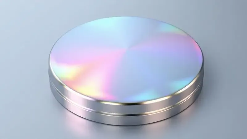 Representação artística de padrões coloridos tipo arco-íris em uma base circular de metal inoxidável.